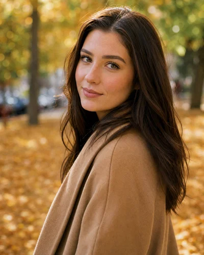 Autumn outdoor portrait with 135mm compression, creamy bokeh, and warm natural leaf bounce.