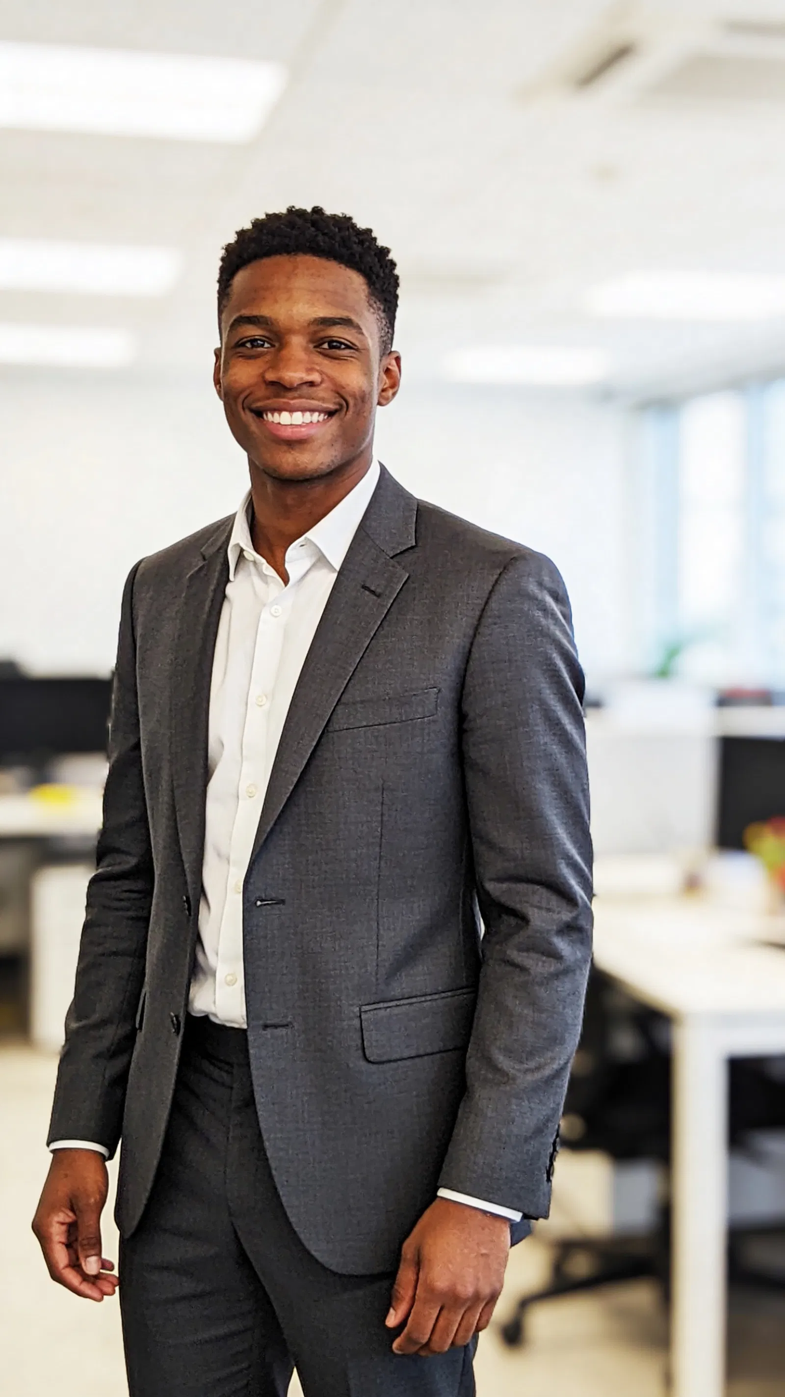 Black man in coworking space with clean professional resume portrait