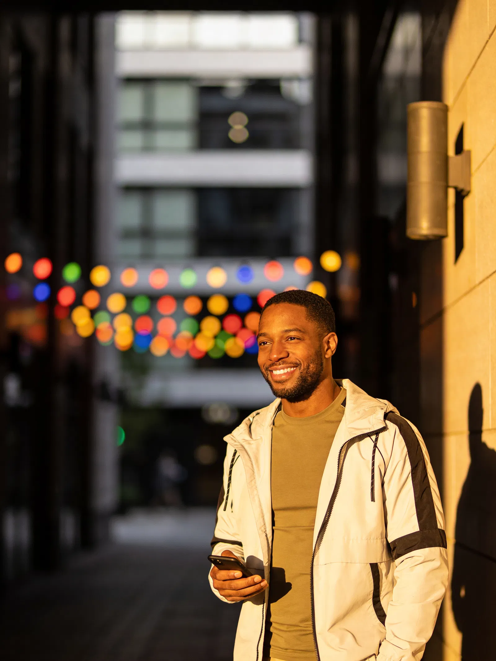 Black man influencer in golden hour street portrait for social media content
