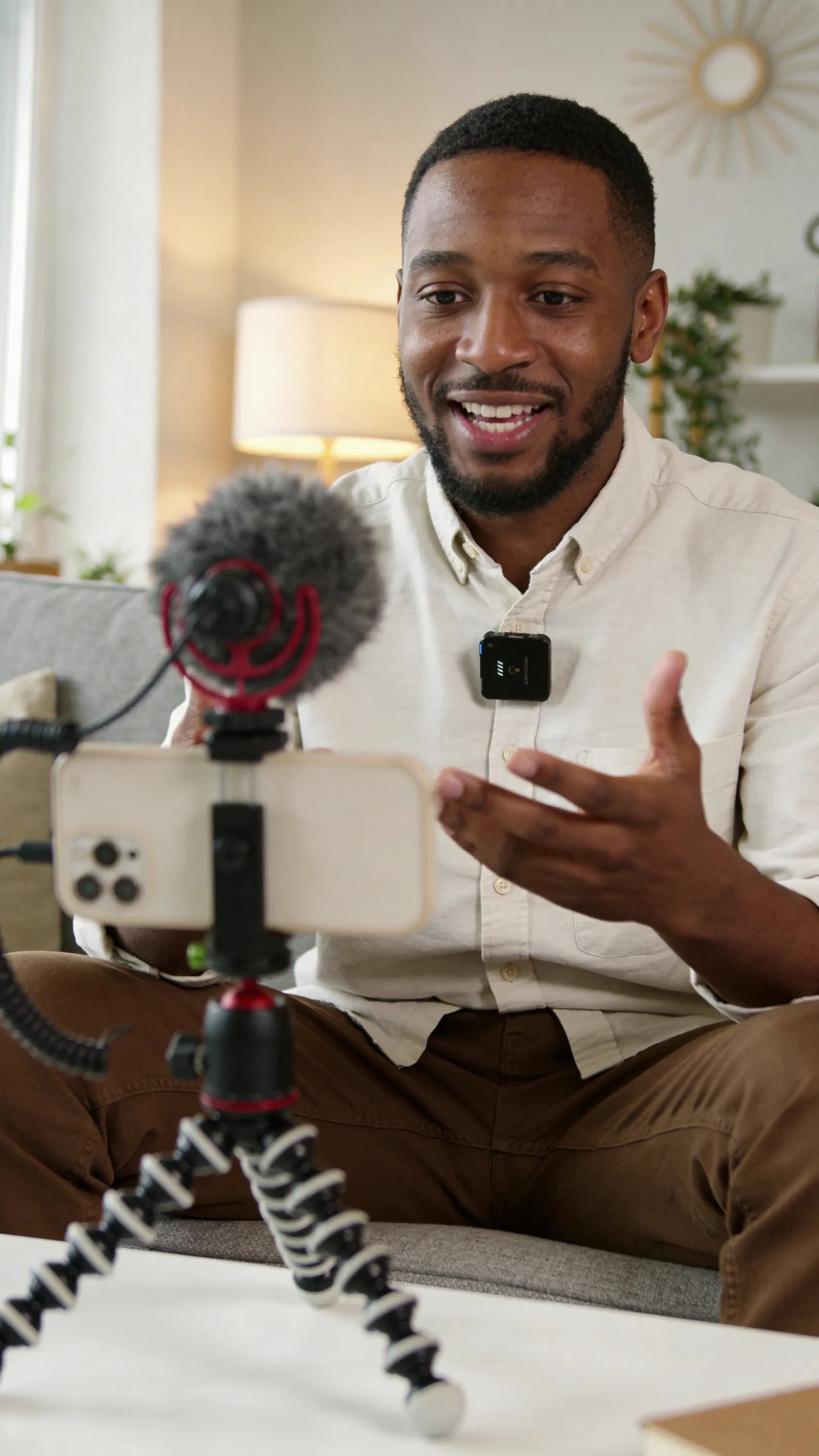 Black man recording a talking-head Instagram Reel at home
