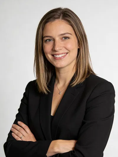 Caucasian woman with arms crossed in studio LinkedIn headshot