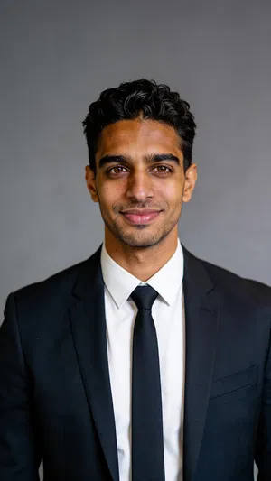 Consistent AI character studio attorney headshot with charcoal background and classic lighting