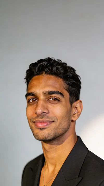 Consistent character in dramatic studio headshot for editorial set