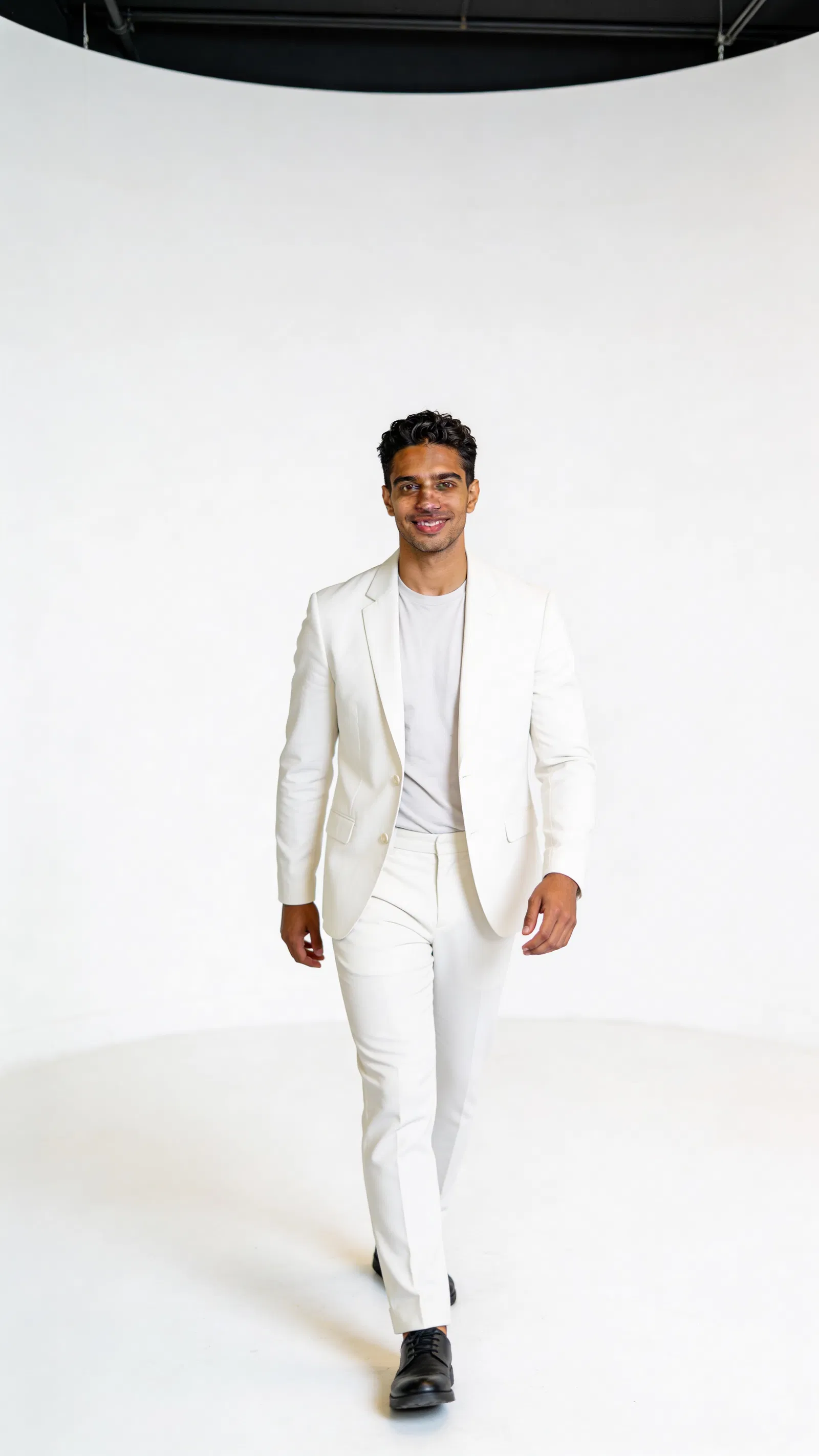 Crisp white studio fashion stance with profile-ready glamour lighting