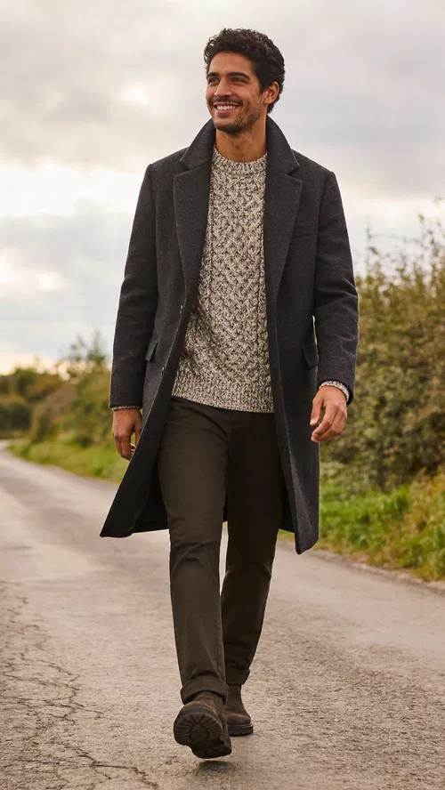 Hispanic man walking countryside lane full-body editorial portrait