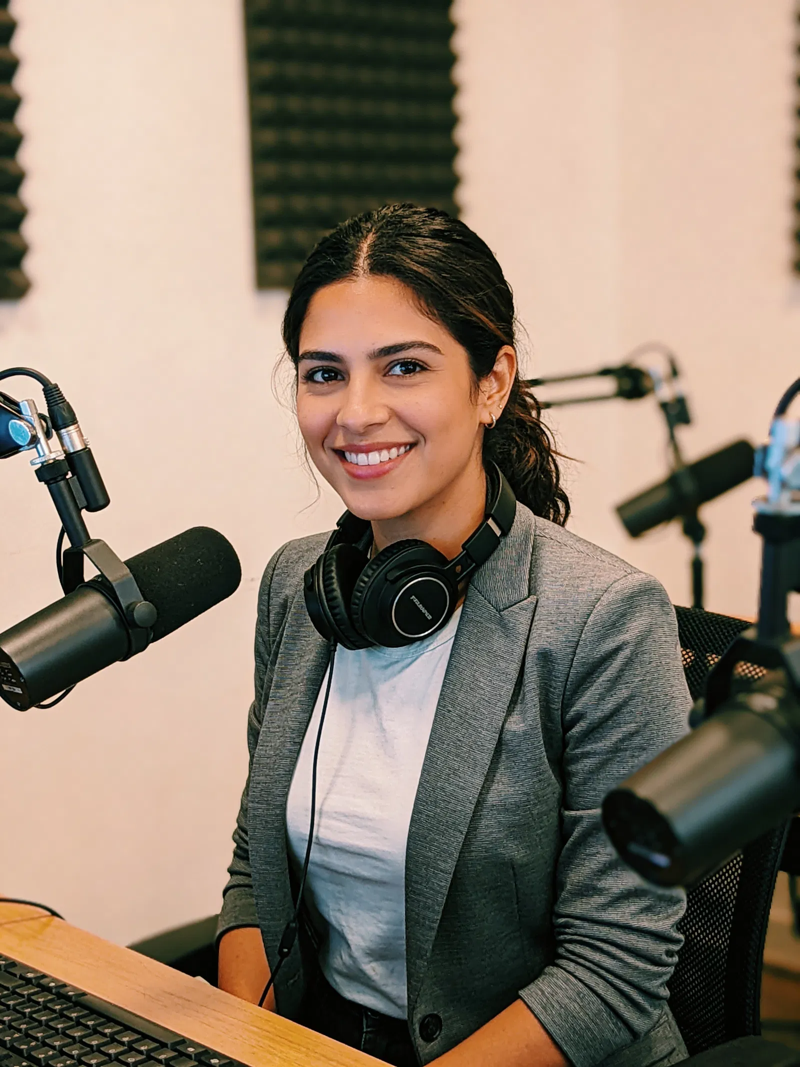 Hispanic woman at podcast setup portrait for personal brand photos