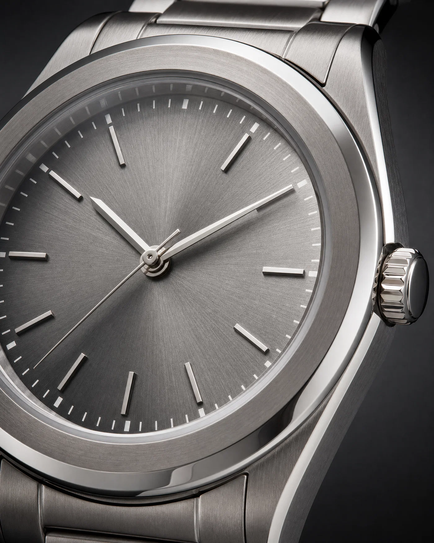 Macro wristwatch shot with controlled catchlights and crisp engraved details on a graphite gradient background.