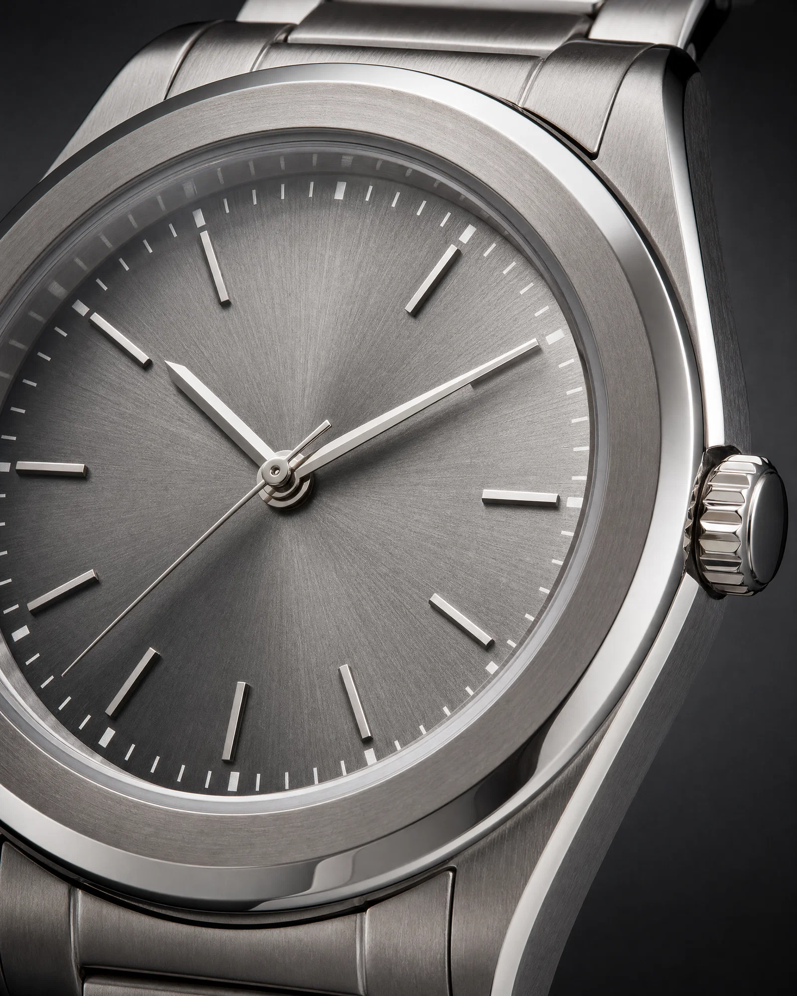 Macro wristwatch shot with controlled catchlights and crisp engraved details on a graphite gradient background.