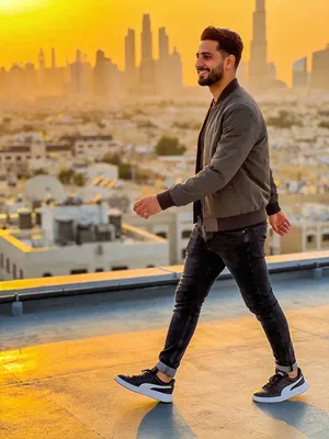 Middle Eastern man rooftop lifestyle portrait for Reels thumbnails and social posts