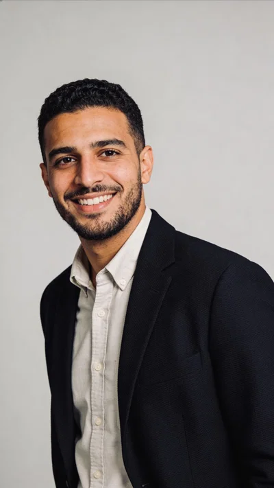 Middle Eastern man with clean studio headshot for resume photo generator