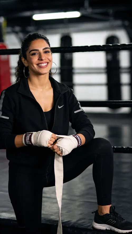 Middle Eastern woman in boxing gym for fitness photoshoot ideas
