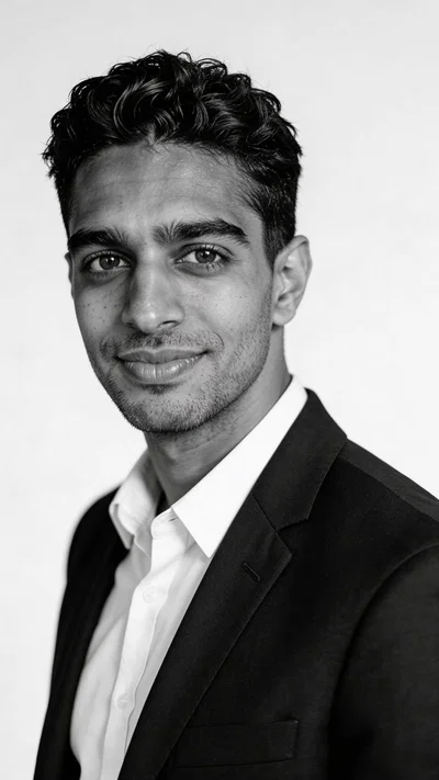 Same character in black-and-white corporate headshot style