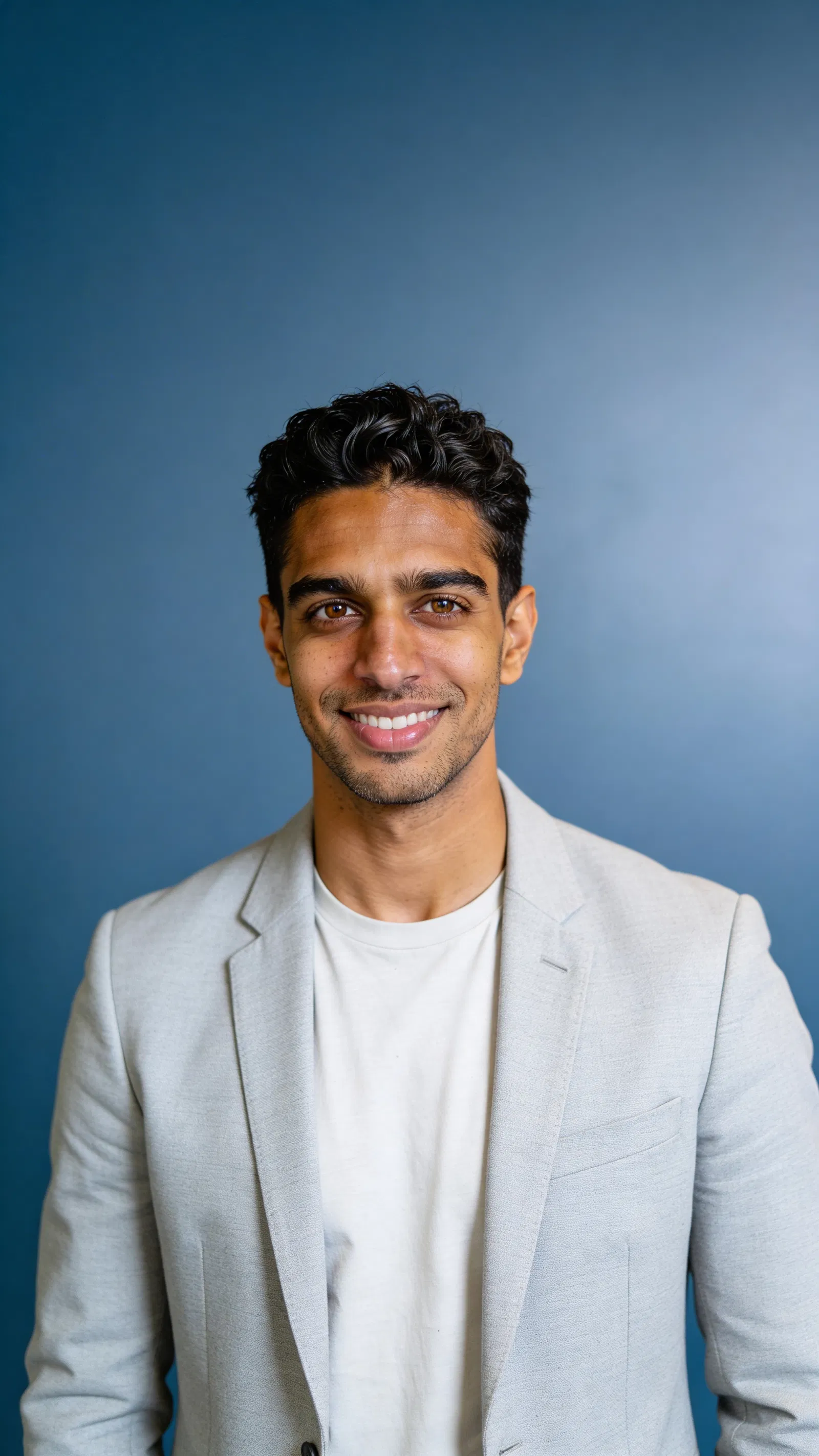 Same character on blue studio backdrop for brand-consistent corporate headshot