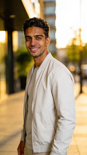 Same character outdoor golden-hour portrait in city setting