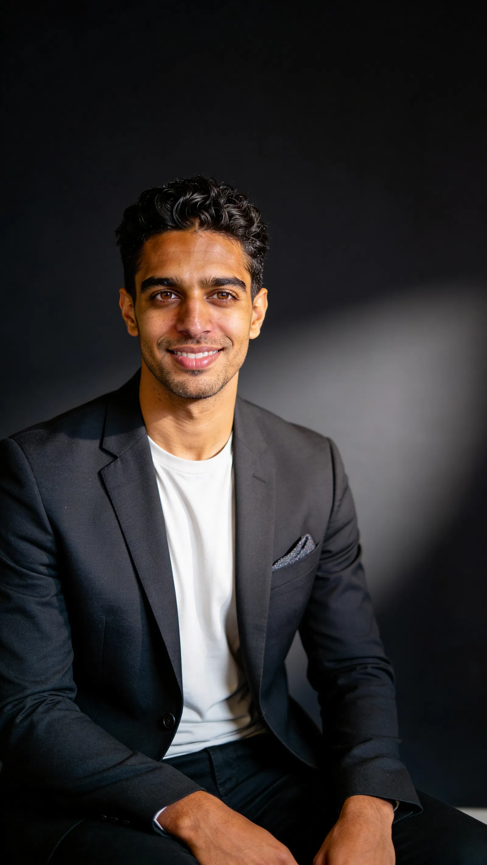 Same character premium executive studio portrait with dark charcoal background