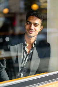 Same person café window editorial portrait