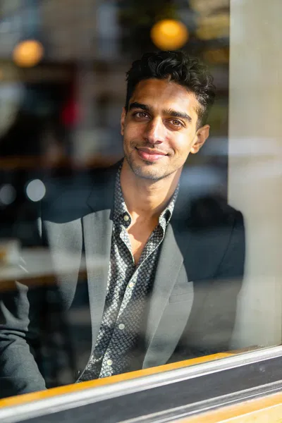 Same person café window editorial portrait