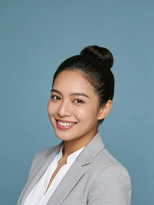 Southeast Asian woman in blazer for crisp studio headshot
