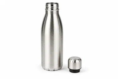Stainless water bottle on pure white seamless with cap beside, even softbox light, and clean natural shadow.