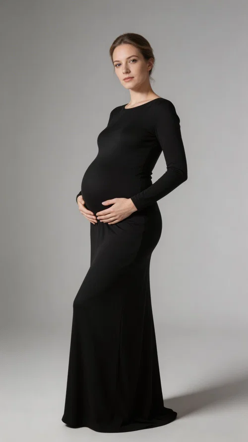 Studio full-body maternity portrait in a black gown