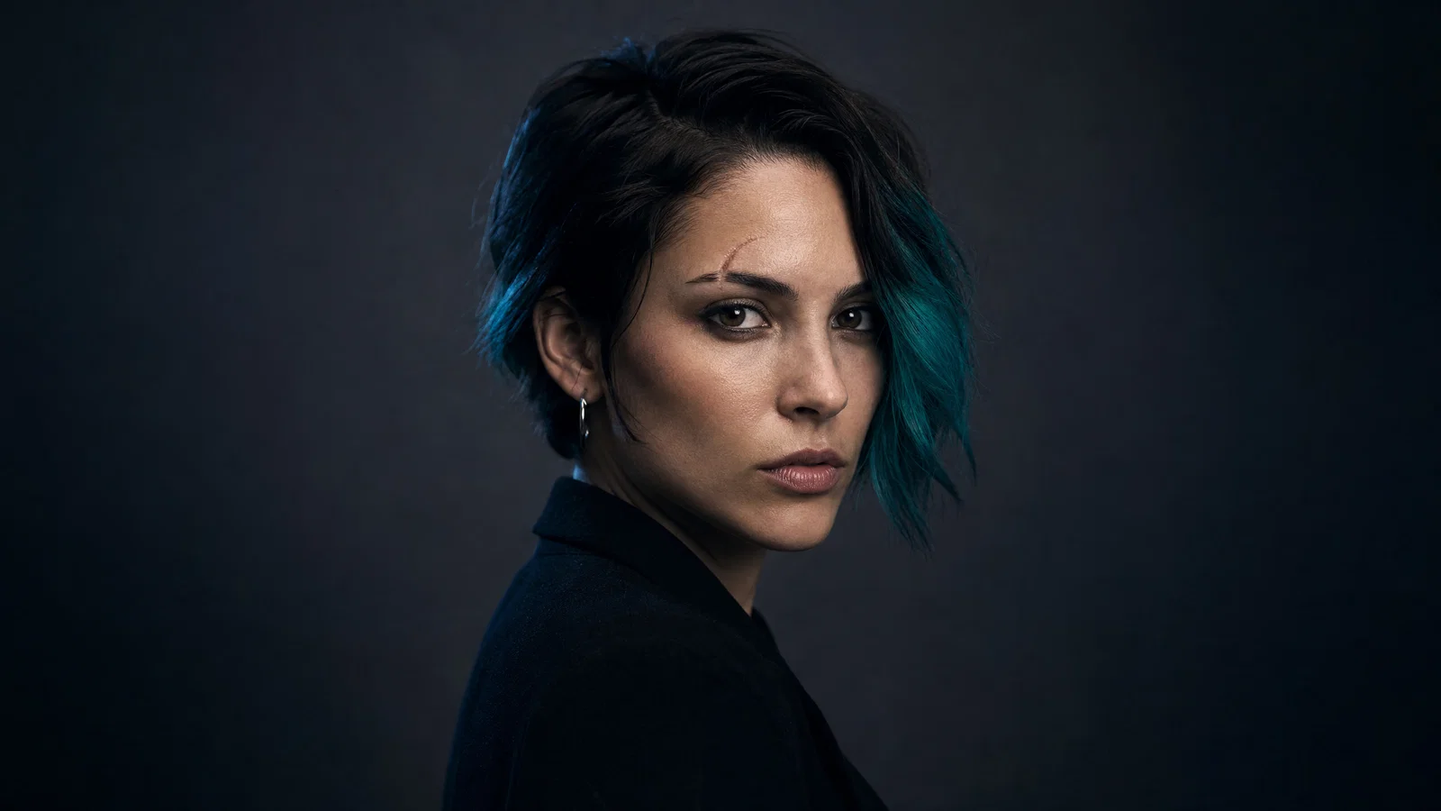 Three-quarter portrait designed for a circular avatar crop with clean studio lighting.