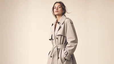 Three-quarter studio lookbook portrait on seamless backdrop with soft editorial lighting.