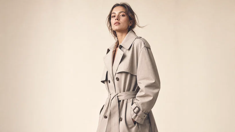 Three-quarter studio lookbook portrait on seamless backdrop with soft editorial lighting.