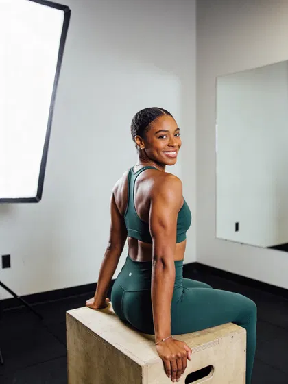 Toned woman seated in boutique gym for professional fitness photos