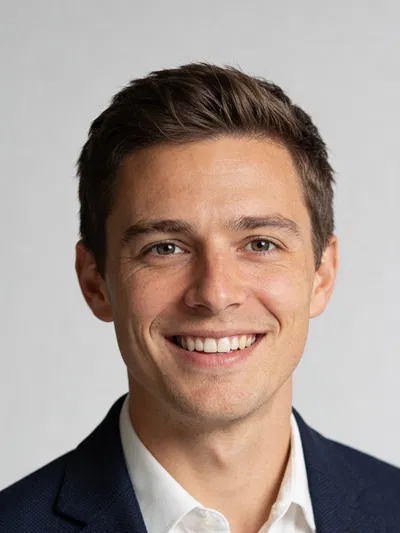 White man in blazer, studio headshot for professional AI headshot generator
