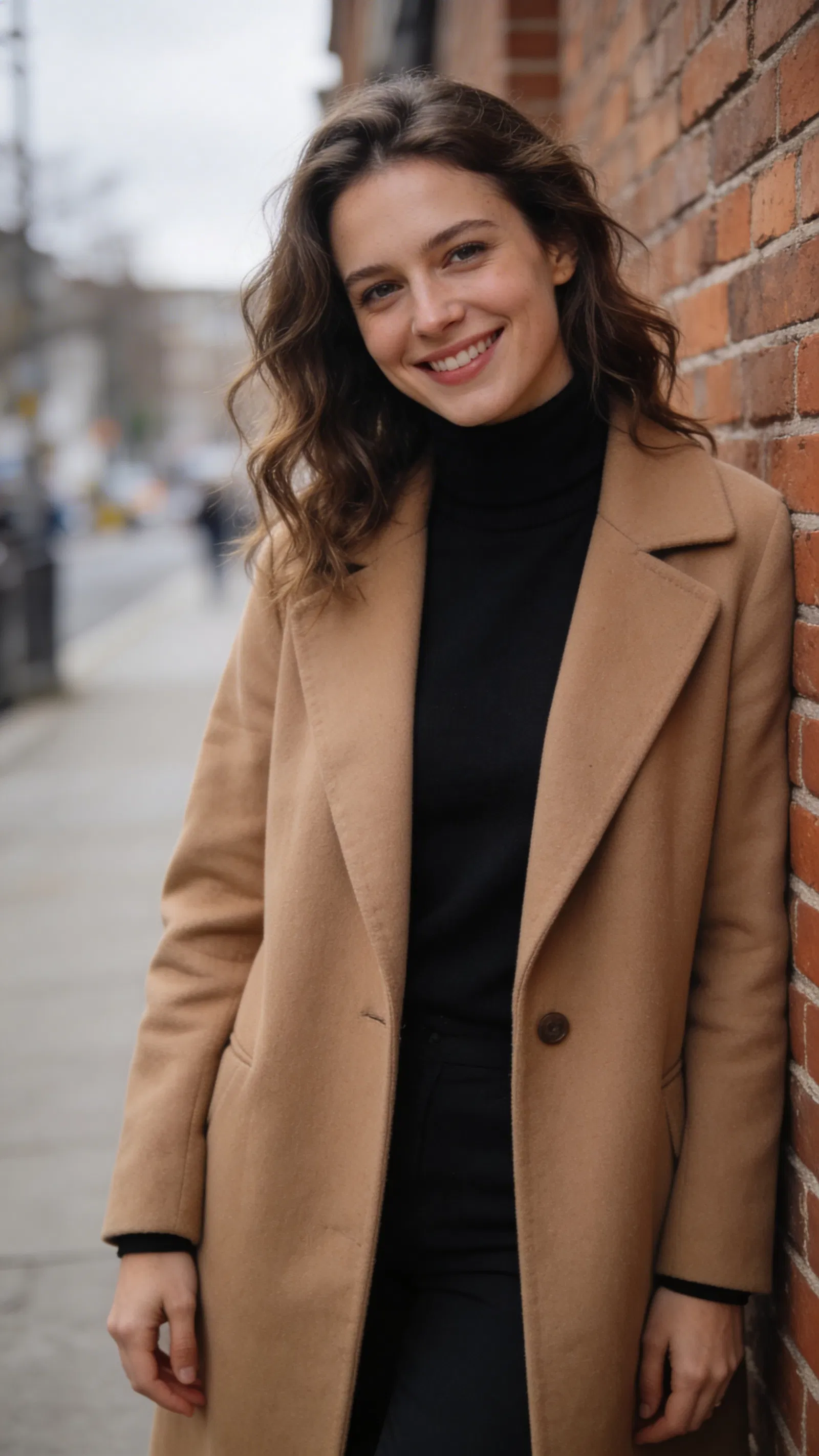 White woman urban half-body portrait leaning on brick wall in soft daylight