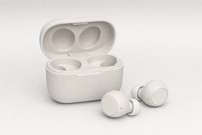 Wireless earbuds case packshot on light gray seamless with soft shadows and clean edge separation.